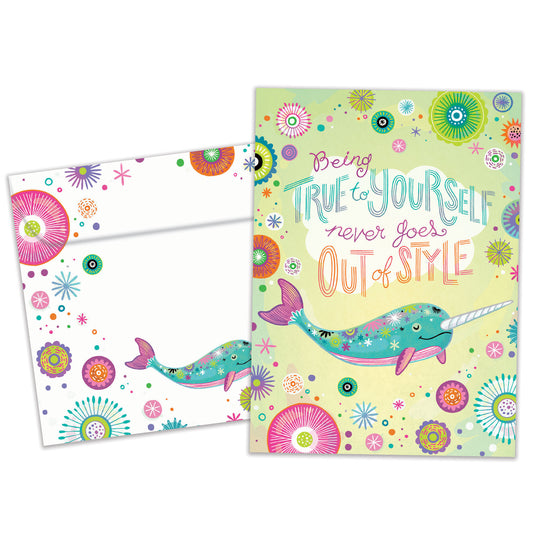 Front view of a Birthday greeting card featuring a pastel-colored narwhal with a message about being true to yourself, with a matching envelope.