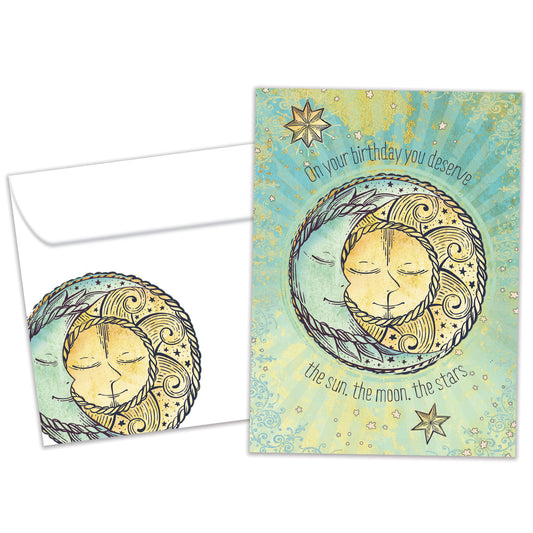 Front view of a Birthday greeting card featuring the sun, moon, and stars with a heartfelt message, with a matching envelope.