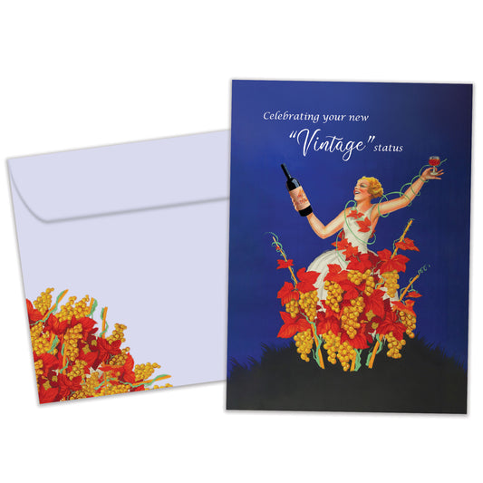 Front view of a Birthday greeting card featuring an illustration of a woman celebrating with wine and a message about vintage status, with a matching envelope.
