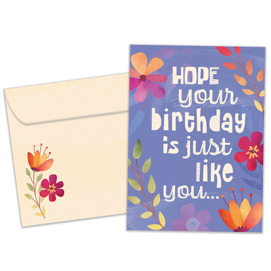 Front view of a Birthday greeting card featuring a floral design on a purple background with a birthday message, with a matching envelope.