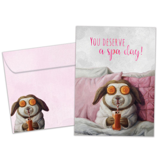 Front view of a Birthday greeting card featuring an illustration of a bunny having a spa day, with a matching envelope.