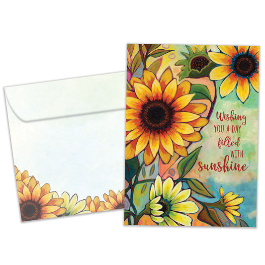 Front view of a birthday greeting card featuring the message "wishing you a day filled with sunshine" and flowers in vibrant fall colours, with a matching envelope.