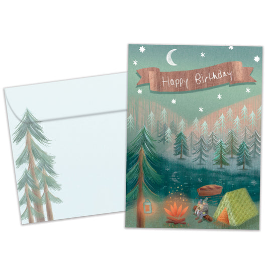 Front view of a birthday greeting card featuring an illustration of two people sitting by a campfire, a tent, and a forest with the message "Happy Birthday", with a matching envelope.