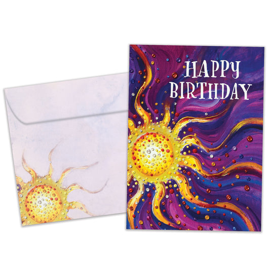 Front view of a birthday greeting card featuring an abstract illustration of a sun on a purple background with the words "Happy Birthday", with a matching envelope.