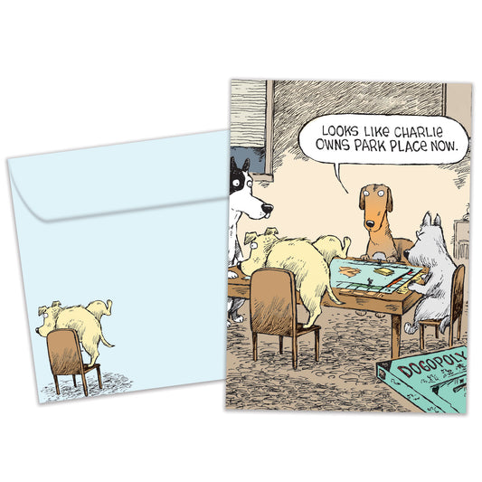 Front view of a birthday greeting card featuring a funny comic of dogs playing Monopoly, with a matching envelope.