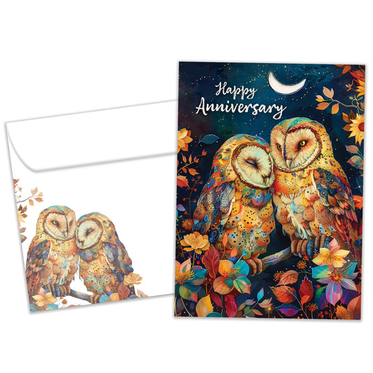 Front view of an Anniversary greeting card and matching envelope featuring an owl couple in a vibrant tree under the moon.