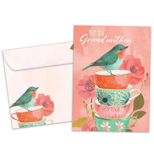Front view of a Birthday greeting card featuring an illustration of a bird standing on a stack of teacups in beautiful pastel colors, with a matching envelope.