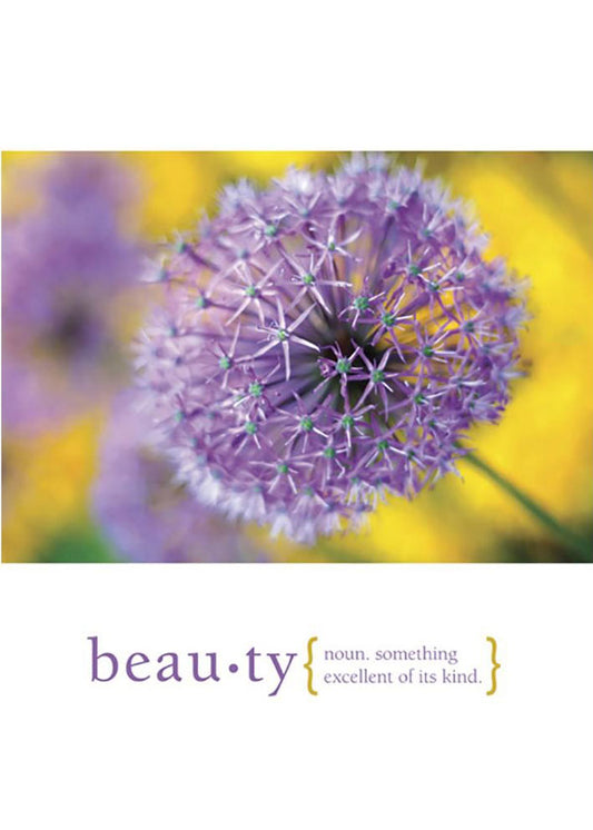 Front view of a Birthday greeting card featuring a close-up of a purple flower and the definition of beauty, with a matching envelope.