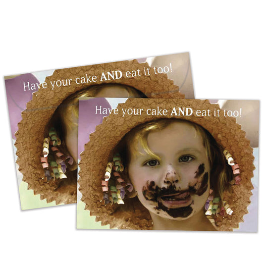 Front view of a Birthday greeting card featuring a close-up of a girl with cake on her face and a message about eating cake, with a matching envelope.