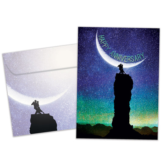 Front view of an Anniversary greeting card and matching envelope featuring a couple dancing in the moonlight with the words "Happy Anniversary."