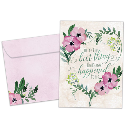Front view of an Anniversary greeting card and matching envelope featuring a pink and green floral design with a loving message.