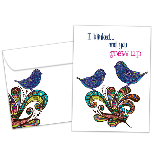 Front view of a Birthday greeting card and matching envelope featuring artistic birds and the message "I blinked…and you grew up."