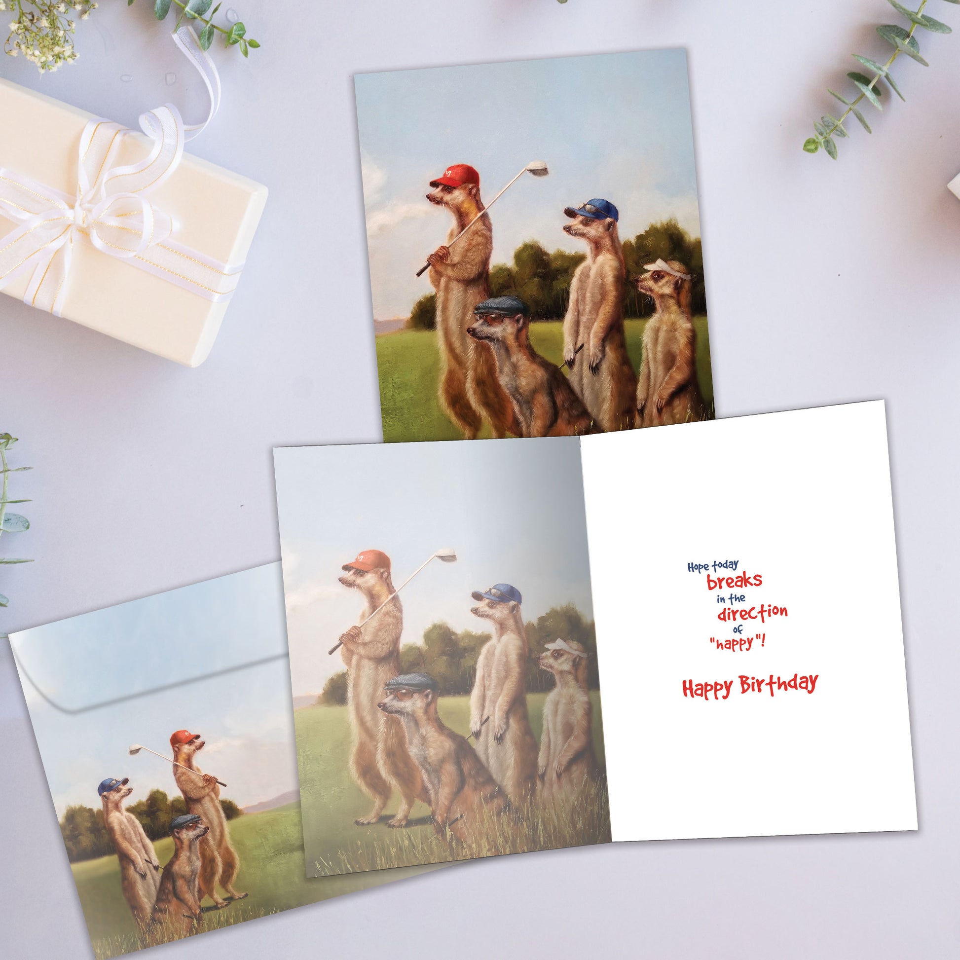 Front and inside view of a Birthday greeting card showcasing prairie dogs golfing, with a matching envelope.