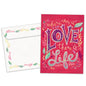Front view of a Birthday greeting card featuring a pink background with the words "where there is love there is life", with a matching envelope.