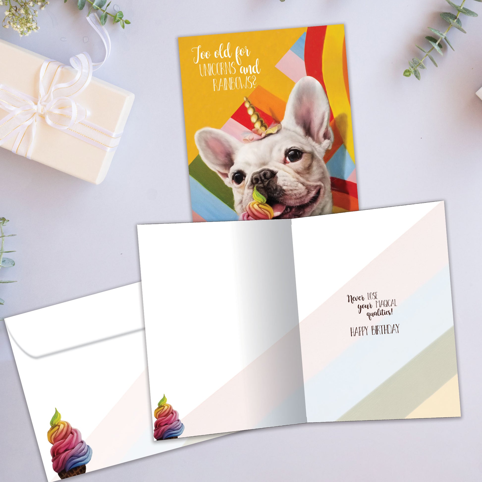 Front and inside view of a Birthday greeting card showcasing a dog eating ice cream and wearing a unicorn hat, with a matching envelope.