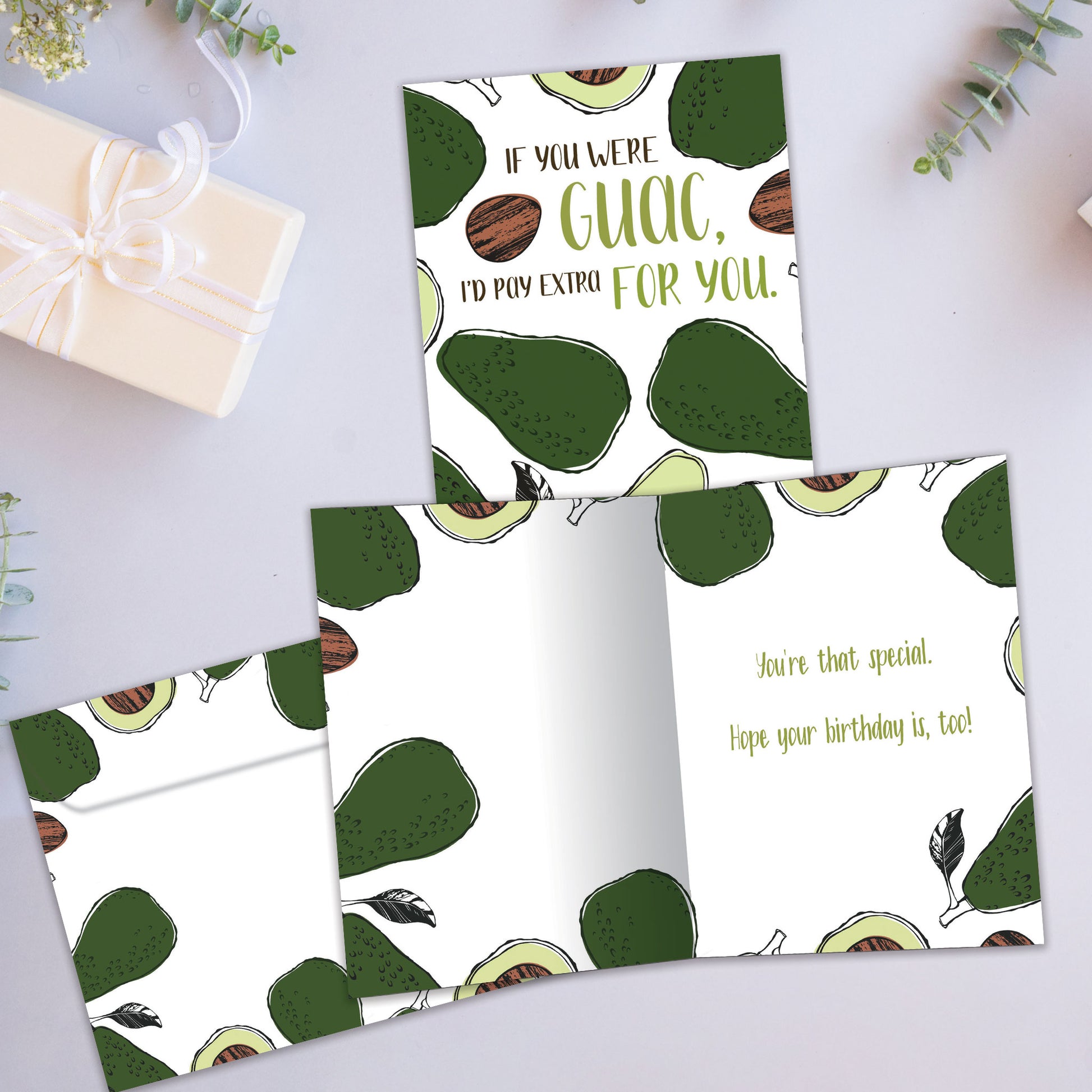 Front and inside view of a Birthday greeting card showcasing the message "if you were guac, I'd pay extra for you" surrounded by avocados, with a matching envelope.