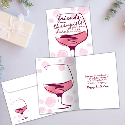 Front and inside view of a Birthday greeting card showcasing an illustration of a glass of wine with a message about friends being therapists, with a matching envelope.