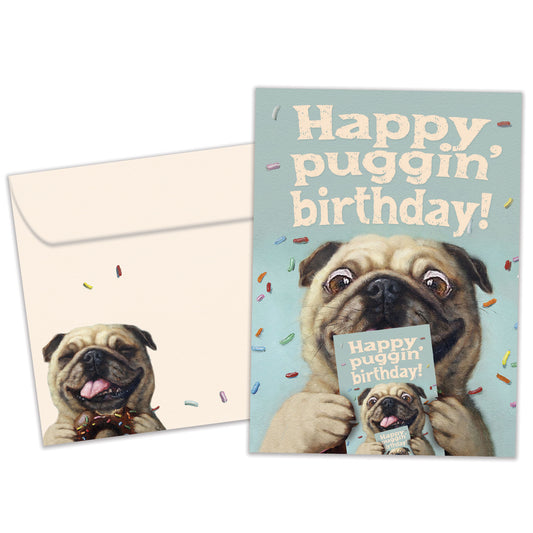 Front view of a Birthday greeting card featuring a playful dog design with the message "happy puggin' birthday", with a matching envelope.