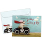 Front view of a Birthday greeting card featuring a bunny in a car design with the message "the years racing by", with a matching envelope.