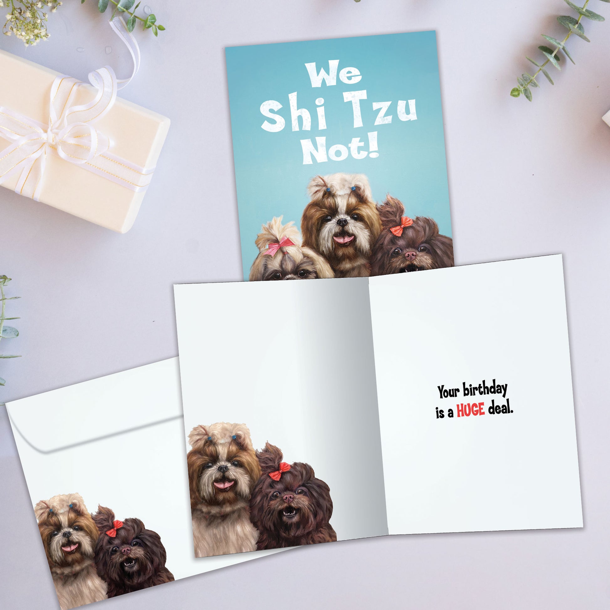 Front and inside view of a Birthday greeting card showcasing 3 dogs with the message "we Shi Tzu not!", with a matching envelope.
