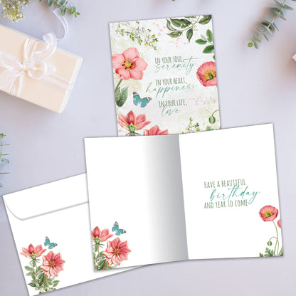 Front and inside view of a Birthday greeting card showcasing a floral design with a message about happiness and love, with a matching envelope.