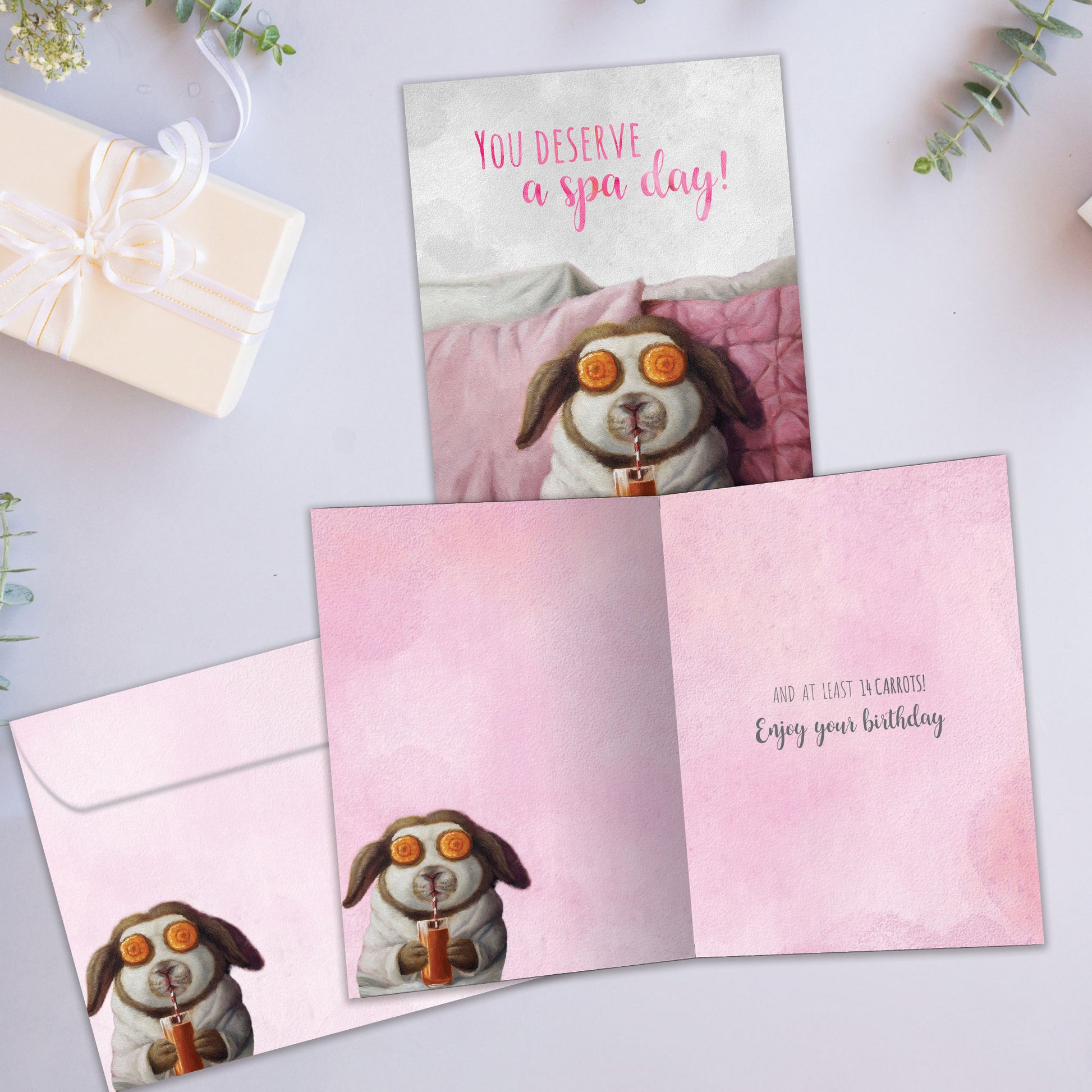 Front and inside view of a Birthday greeting card showcasing an illustration of a bunny having a spa day, with a matching envelope.