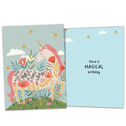 Front and inside view of a Birthday greeting card featuring a pink unicorn with a magical message about believing, with matching design details inside.