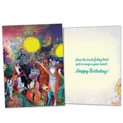 Front view of a Birthday greeting card featuring a vibrant illustration of musical animals, with matching envelope artwork.