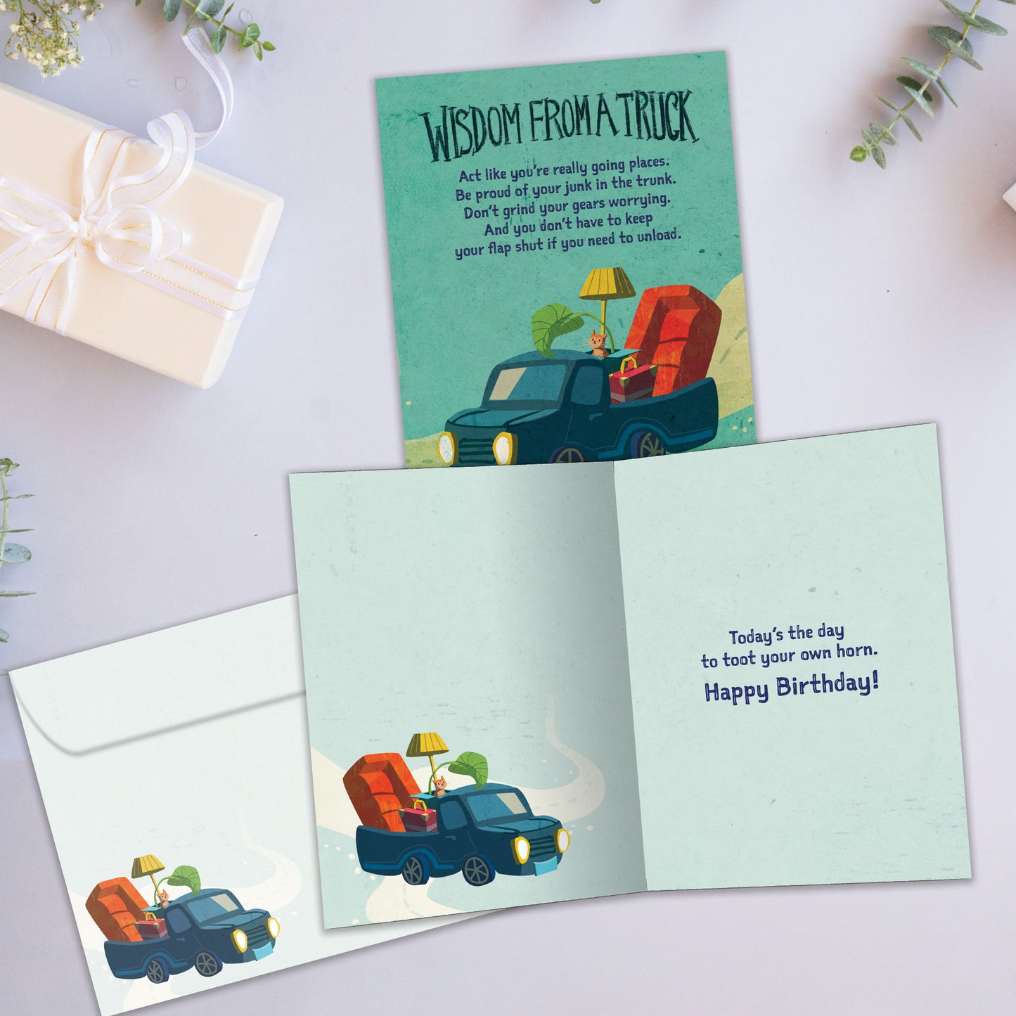 Front and inside view of a Birthday greeting card showcasing a truck with words of wisdom from a truck, with a matching envelope.