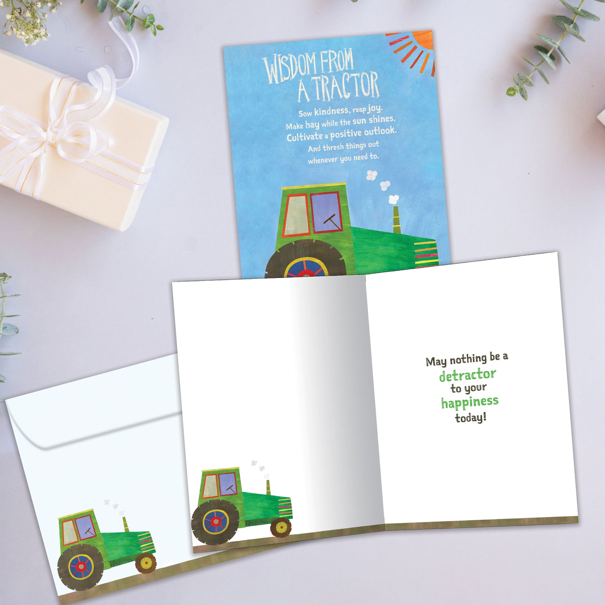 Front and inside view of a Birthday greeting card showcasing a tractor with words of wisdom, with a matching envelope.
