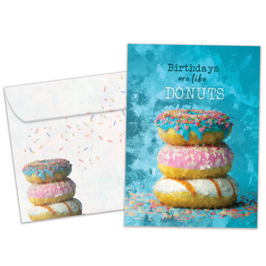 Front view of a Birthday greeting card featuring a stack of donuts with the message "birthdays are like donuts", with a matching envelope.