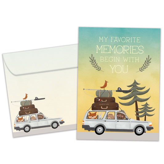Front view of a Birthday greeting card featuring an animal family in a car going on a camping vacation with a message about memories, with a matching envelope.