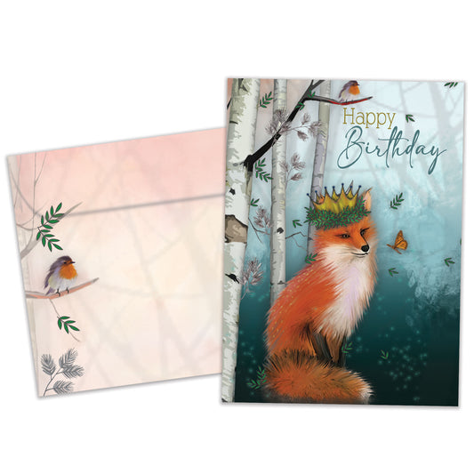 Front view of a Birthday greeting card featuring a fox wearing a crown in a serene, soft forest background, with a matching envelope.