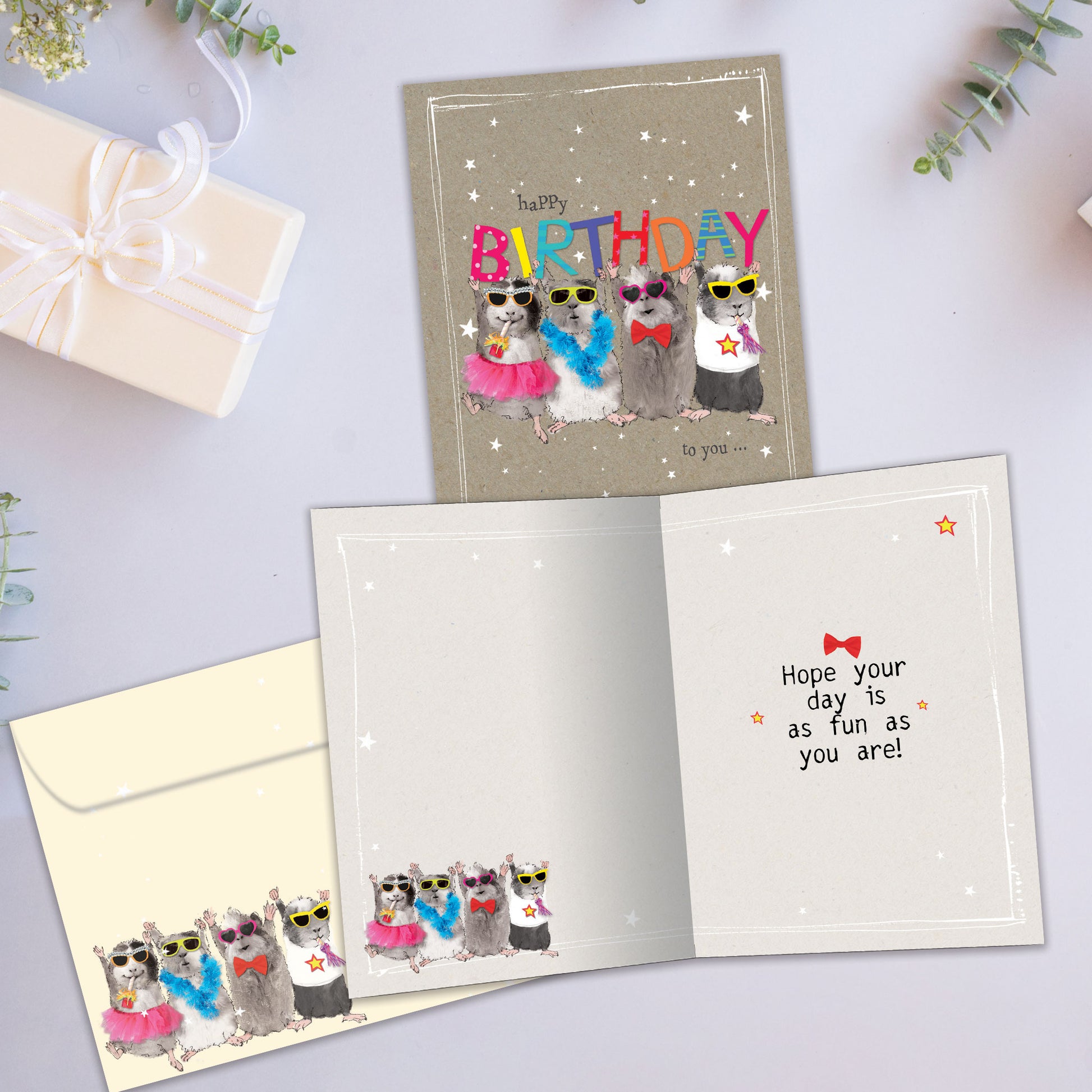 Front and inside view of a Birthday greeting card showcasing mice holding up a colourful "happy birthday" message, with a matching envelope.
