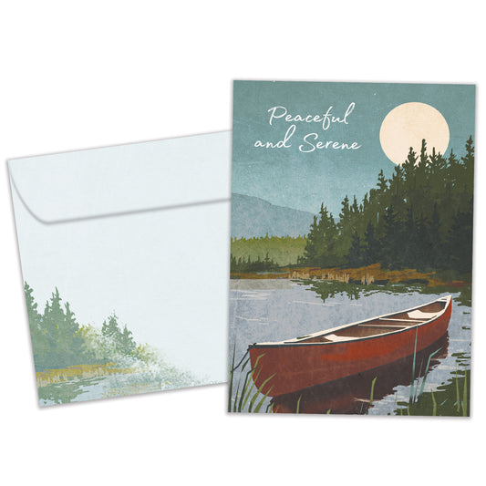 Front view of a birthday greeting card featuring an illustration of a canoe on a lake with the message "Peaceful and Serene", with a matching envelope.