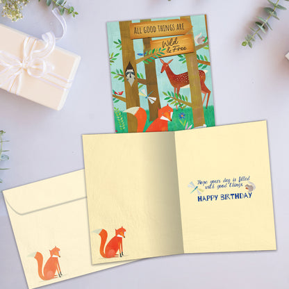 Front and inside view of a birthday greeting card showcasing an illustration of a forest scene with animals and a message about being wild and free, with a matching envelope.