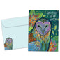 Front view of a birthday greeting card featuring an artistic and colourful illustration of an owl and foliage with the message "another year wiser", with a matching envelope.
