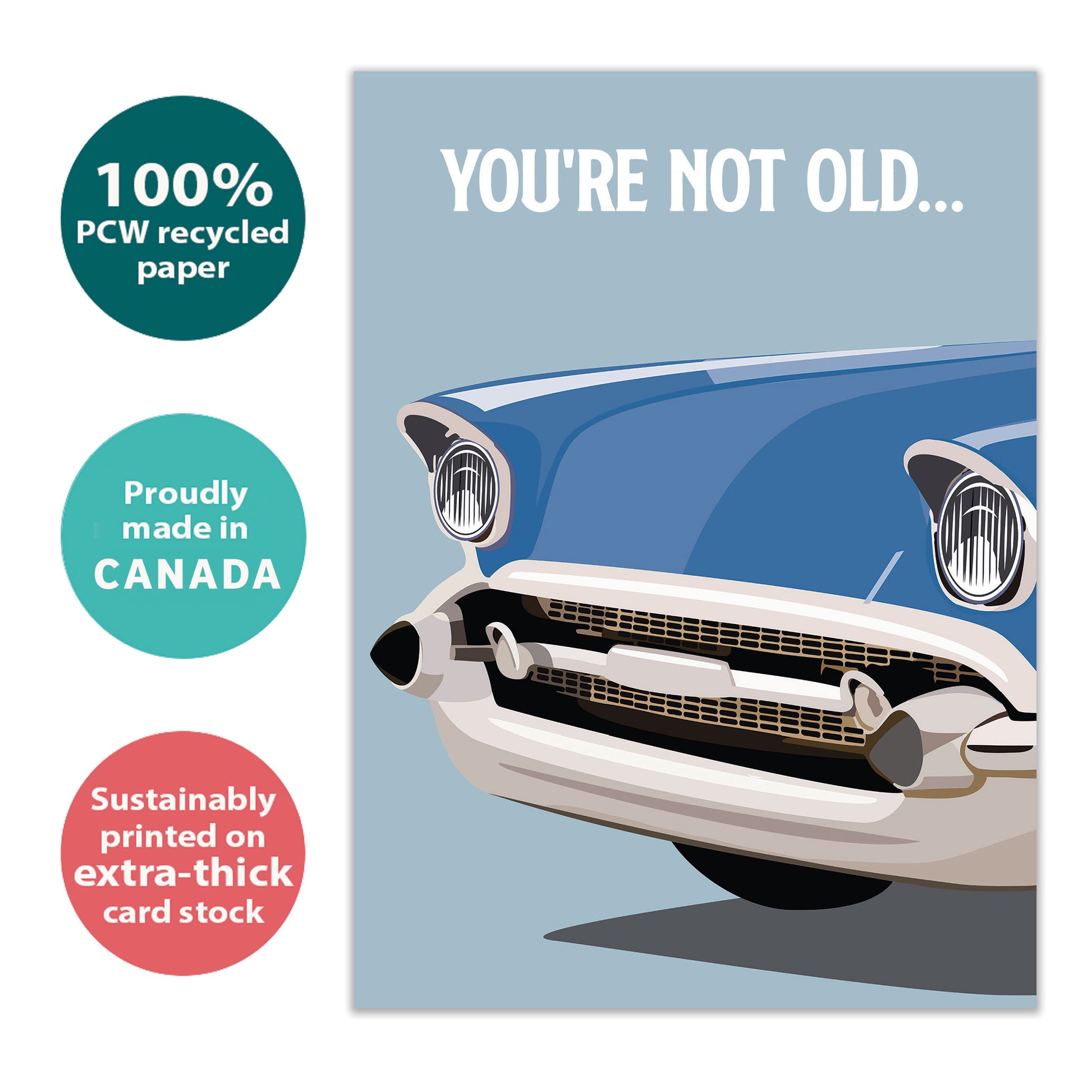 Front view of a birthday greeting card with an illustration of a classic car and the message "you're not old...", highlighting its eco-friendly materials and made in Canada.