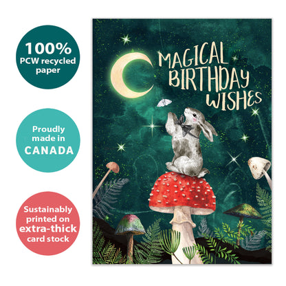 Front view of a Birthday greeting card with a bunny on a mushroom under the moon, highlighting its eco-friendly materials and made in Canada.