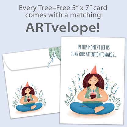 Front view of a Birthday greeting card featuring a woman meditating and holding a cupcake and a message, with matching envelope artwork.