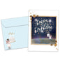 Front view of a Birthday greeting card featuring a fairy holding a birthday cake and the message "Happy Birthday", with a matching envelope. 
