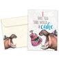 Front view of a Birthday greeting card featuring an image of a hippopotamus wearing a birthday cap about to eat cake, with a matching envelope