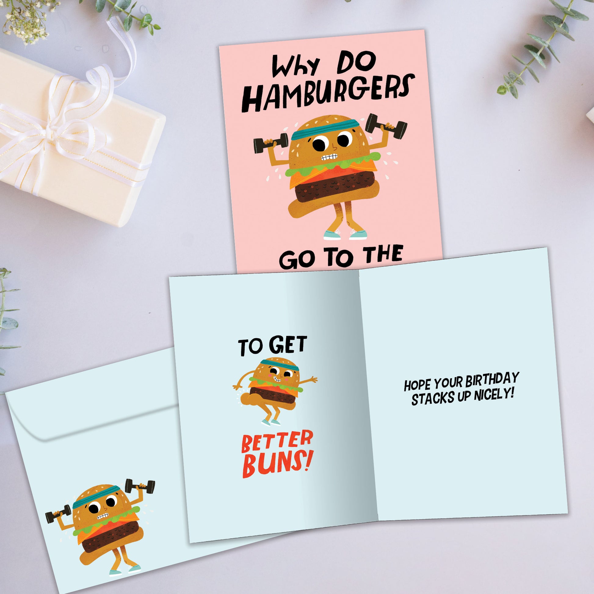 Front and inside view of a Birthday greeting card a hamburger lifting weights and a funny message on the inside, with a matching envelope