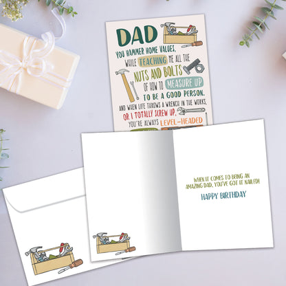 Front and inside view of a Birthday greeting card showcasing a message to Dad and images of various tools, with a matching envelope