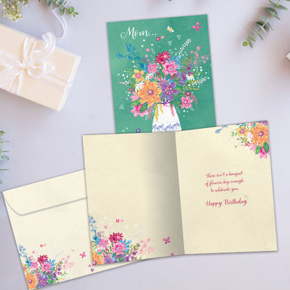 Front and inside view of a Birthday greeting card showcasing an illustration of a vase of flowers and the message "Mom", with a matching envelope