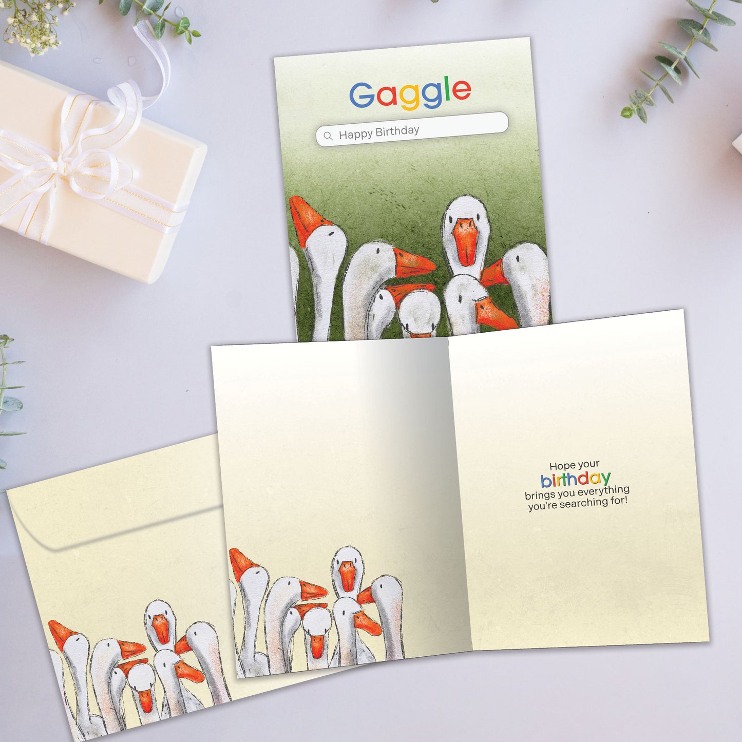 Front and inside view of a Birthday greeting card featuring several geese on a search engine page named Gaggle, with a matching envelope