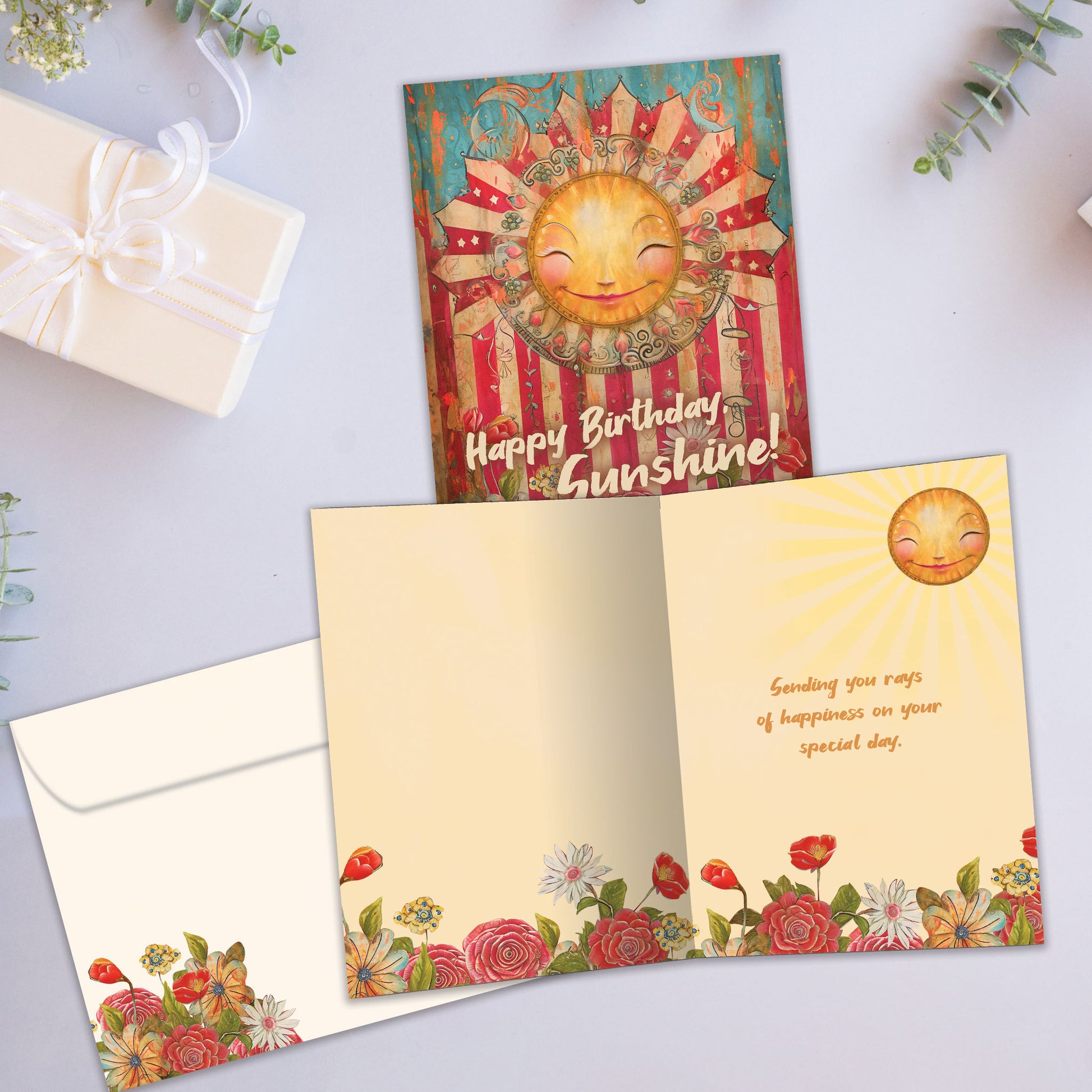 Front and inside view of a Birthday greeting card featuring a smiling sun, flowers and the message "Happy Birthday Sunshine!", with a matching envelope