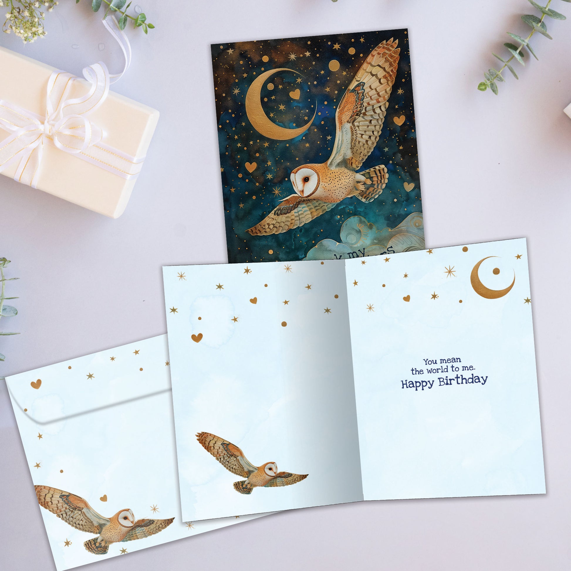 Front and inside view of a Birthday greeting card featuring an owl flying at night with the message "I thank my lucky stars", with a matching envelope