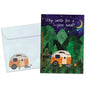 Front view of a Birthday greeting card featuring an illustration of a camper in the woods at night, with a matching envelope.