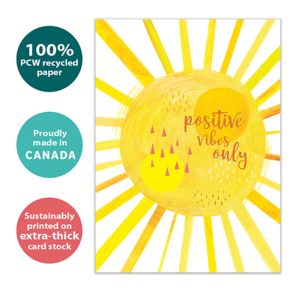 Front view of an All Occasion greeting card with a bright yellow sunshine illustration and the words 'positive vibes only,' highlighting its eco-friendly materials and made in Canada.